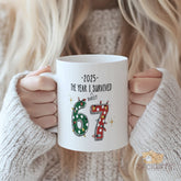 2025 I Survived Mug - Funny 67 Barely Survival Humor Gift, Ceramic Coffee Cup with Christmas Lights, Novelty Gift for Friends, Coworkers, Him, Her, Christmas, Birthday, Office Secret Santa, White Elephant Gift